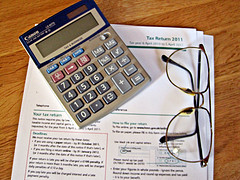 Taxes, Calculator and Glasses | Source: Images_of_Money