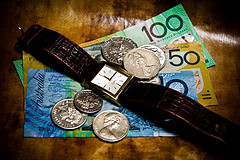 Watch on top of money - Source: Nina Matthews Photography